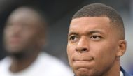 France's forward Kylian Mbappe looks on as he warms up prior to the UEFA Euro 2024 group B qualification football match between France and Greece at the Stade de France in Saint-Denis, in the northern outskirts of Paris, on June 19, 2023. (Photo by Alain JOCARD / AFP)