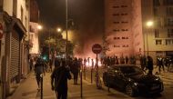 People burn rubish bins and block a street during a protest in Paris on June 29, 2023, a day after the killing of 17-year-old boy, named only as Nahel M., in Nanterre by a police officer. (Photo by Fiachra GIBBONS / AFP)