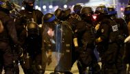 French police officers detain a demonstrator in Paris on July 2, 2023, five days after a 17-year-old man was killed by police in Nanterre, a western suburb of Paris. (Photo by Ludovic Marin / AFP)