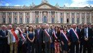 Mayor of Toulouse Jean-Luc Moudenc (centre) poses with participants during a nationwide action in Toulouse, southern France on July 3, 2023, after France's mayors have called on the population and elected representatives to gather in front of all town halls at midday, invoking 