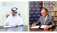 H E Dr. Mohammed bin Saleh Al-Sada, a Member of the Board of Trustees at the Al-Attiyah Foundation, and Paul Salem, President, and CEO of the MEI signing the MoU.