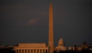 The US Capitol and washington Monument are seen ahead of the Independence Day fireworks display along the National Mall in washington, DC, on July 4, 2023. (Photo by Stefani Reynolds / AFP)
