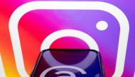 This photo illustration created in Washington, DC, on July 5, 2023, shows the logos for Threads, an Instagram app, and Instagram. Facebook owner Meta's new Threads app, meant to compete with Twitter, was available for pre-order on mobile app stores on iPhone and Android operating systems on July 5, 2023. (Photo by Stefani Reynolds / AFP)
