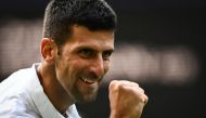 Serbia's Novak Djokovic celebrates after winning against Australia's Jordan Thompson during their men's singles tennis match on the third day of the 2023 Wimbledon Championships at The All England Tennis Club in Wimbledon, southwest London, on July 5, 2023. (Photo by SEBASTIEN BOZON / AFP) 

