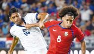El Salvador’s Christian Martinez (left) and Panama’s Adalberto Carrasquilla in action. AFP