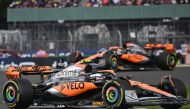 McLaren's British driver Lando Norris and McLaren's Australian driver Oscar Piastri drive during the Formula One British Grand Prix at the Silverstone motor racing circuit in Silverstone, central England on July 9, 2023. Photo by ANDREJ ISAKOVIC / AFP
