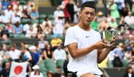 Japan's Tokito Oda holds his trophy after beating Britain's Alfie Hewett during their men's wheelchair singles final tennis match on the last day of the 2023 Wimbledon Championships at The All England Tennis Club in Wimbledon, southwest London, on July 16, 2023. Photo by SEBASTIEN BOZON / AFP
