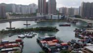 Boats are moored at a typhoon shelter in Tseun Wan as a precaution for the approaching Typhoon Talim in Hong Kong on July 16, 2023. (Photo by May James / AFP)