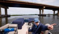 Activist and Captain Bill Sheehan speaks as he drives his boat along the Hackensack River in Secaucus, New Jersey, on June 15, 2023. (Photo by Kena Betancur / AFP)