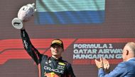 Max Verstappen raises the trophy after winning the Formula One Hungarian Grand Prix, yesterday. AFP