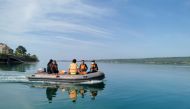 This handout photo from Indonesia's National Rescue Agency (Basarnas) taken and released on July 24, 2023 shows members of a rescue team setting out to conduct search and rescue operations in Buton Tengah, southeast Sulawesi after a ferry sank. (Photo by Handout / Basarnas / AFP) 