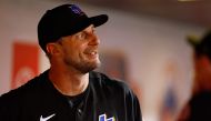 (FILES) Pitcher Max Scherzer, #21 of the New York Mets, smiles in the dugout after walking off the field in the seventh inning against the Washington Nationals at Citi Field in New York City on July 28, 2023.  (Photo by Rich Schultz / GETTY IMAGES NORTH AMERICA / AFP)
