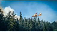 This July 21, 2023, image released by the Societe De Protection Des Forets (SOPFEU) on shows a firefighting plane battling Fire 593 in central Quebec Province, Canada. Photo by Jesse Larriviere / Societe De Protection Des Forets / AFP