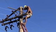 This handout picture released by the Minas Gerais Fire Department show a fugitive climbed on an electric pole while escaping from the police in the town of Itabira, Brazil on August 5, 2023. (Photo by Handout / Minas Gerais Fire Department / AFP) 