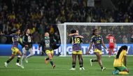 Players react at the end of the Australia and New Zealand 2023 Women's World Cup round of 16 football match between Jamaica and Colombia in Melbourne on August 8, 2023. (Photo by William West / AFP)