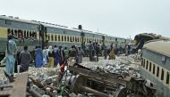 Workers repair a damaged track, a day after the derailment of a passenger train in Nawabshah on August 7, 2023. Photo by Asif HASSAN / AFP