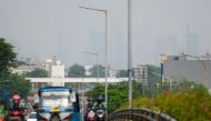 Skyscrapers (background) look faded due to poor air quality in Jakarta on August 11, 2023. Photo by BAY ISMOYO / AFP