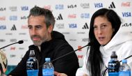 Team Spain head coach Jorge Vilda (L) and player Jennifer Hermoso attend a press conference at Eden Park in Auckland on August 14, 2023. (Photo by Saeed Khan / AFP) 