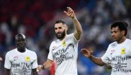  Karim Benzema celebrates with team mates after they won the Saudi Pro League football match between Al-Raed and Al-Ittihad at the King Abdullah Sports City stadium in Buraidah on August 14, 2023. (Photo by AFP)