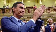 Acting Prime Minister Pedro Sanchez claps as he arrives to attend the Parliament's constitutive sitting at the Congress of Deputies in Madrid on August 17, 2023. (Photo by Javier Soriano / AFP)