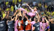 Teammates hold up Inter Miami's Argentine forward #10 Lionel Messi as they celebrate after winning the Leagues Cup final football match against Nashville SC at Geodis Park in Nashville, Tennessee, on August 19, 2023. (Photo by Chandan Khanna / AFP)
