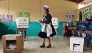 An Indigenous woman casts her vote at a polling station in Tarqui, canton of Cuenca, Azuay Province, during the Ecuadorean presidential election and referendum on mining and petroleum, on August 20, 2023. (Photo by Cristina Vega Rhor / AFP)