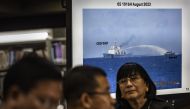 Footage of a Chinese Coast Guard ship using a water cannon against a Filipino resupply vessel is shown during a press conference at the Department of Foreign Affairs in Manila on August 7, 2023. Photo by Ezra Acayan / POOL / AFP

