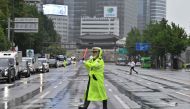 A police officer controls traffic on an empty street during a civil defence drill against possible artillery attacks by North Korea in Seoul on August 23, 2023. Photo by Jung Yeon-je / AFP