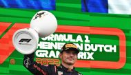 Red Bull Racing's Dutch driver Max Verstappen celebrates with the trophy on the podium after winning the Dutch Formula One Grand Prix race at The Circuit Zandvoort, in Zandvoort on August 27, 2023. (Photo by John Thys / AFP)