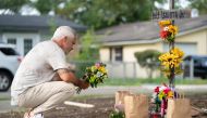 Will Walsh visits memorials for Jerrald Gallion, Angela Carr and Anolt Joseph Laguerre Jr. near a Dollar General store where they were shot and killed two days earlier on August 28, 2023 in Jacksonville, Florida. (Photo by Sean Rayford / GETTY IMAGES NORTH AMERICA / Getty Images via AFP)
