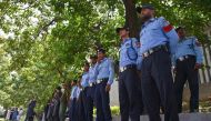 Policemen stand guard outside the Islamabad High Court building in Islamabad on August 29, 2023, during the hearing of Imran Khan's plea seeking suspension of a three-year jail term. (Photo by Farooq Naeem / AFP)