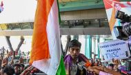 India's chess grandmaster and silver medallist Rameshbabu Praggnanandhaa, responds to a television media personnel as he is welcomed upon his return from the FIDE Chess World Cup in Baku, at the Chennai International airport in Chennai, on August 30, 2023. (Photo by AFP)