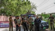 Security personnel stand guard outside the Attock prison, where former Pakistan prime minister Imran Khan is sentenced, in Attock on August 30, 2023. (Photo by Abdul Majeed / AFP)