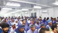 Workers attend an awareness session on heat stress safety. 