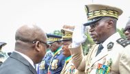File photo: Head of Gabon's elite Republican Guard, General Brice Oligui Nguema (right), is decorated by Gabon Prime Minister Alain Claude Bilie Bie Nze (left) in Libreville on August 16, 2023 during celebrations ahead of Gabon Independence day celebrated on August 17, 2023. (Photo by AFP)