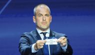 English former football player Joe Cole shows the paper slip of Paris Saint-Germain during the draw for the 2023/2024 UEFA Champions League yesterday. AFP