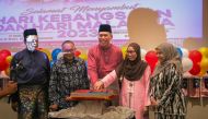 Embassy of Malaysia Ambassador to Qatar, H E Zamshari Shaharan (third left) spearheading the cake-cutting ceremony marking the Malaysia National Day celebration yesterday at Al Khor.