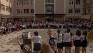 Pupils gather with their relatives and teachers for a ceremony to mark the start of the new school year, known as the 'Day of Knowledge' in Irpin, northwest of Kyiv, on September 1, 2023, amid the Russian invasion of Ukraine. Photo by Roman Pilipey / AFP