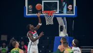 USA Anthony Edwards ( 2nd L) shoots the ball during the FIBA Basketball World Cup second round match between USA and Lithuania at Mall of Asia Arena in Pasay City, suburban Manila on September 3, 2023. (Photo by JAM STA ROSA / AFP)
