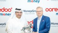 Ooredoo Qatar Chief Executive Officer, Sheikh Ali bin Jabor Al Thani receiving an award from MoneyGram Chairman and CEO, Alex Holmes.