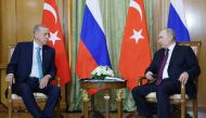 In this handout photograph taken and released by Turkish Presidential Press Office on September 4, 2023, Russian President Vladimir Putin (right) and Turkish President Recep Tayyip Erdogan attend a meeting in Sochi. (Photo by Murat Cetin Muhurdar / TURKISH PRESIDENTIAL PRESS SERVICE / AFP) 