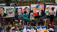 Students work on paintings of world leaders at an art school in Mumbai on September 5, 2023, ahead of the two-day G20 summit in New Delhi. (Photo by Punit Paranjpe / AFP)