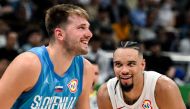 Canada's Dillon Brooks (R) and Slovenia's Luka Doncic react during the FIBA Basketball World Cup quarter-final match between Canada and Slovenia at the Mall of Asia Arena in Manila on September 6, 2023. Photo by SHERWIN VARDELEON / AFP