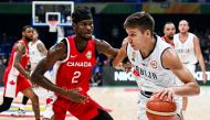 Serbia's Bogdan Bogdanovic (R) blows past Canada's Shai Gilgeous-Alexander (L) during the FIBA Basketball World Cup semi-final match between Serbia and Canada in Manila on September 8, 2023. (Photo by SHERWIN VARDELEON / AFP)