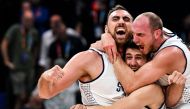 (From left) Serbia's Nikola Milutinov, Vanja Marinkovic, and Dejan Davidovac celebrate victory at the end of the FIBA Basketball World Cup semi-final match between Serbia and Canada in Manila on September 8, 2023. (Photo by Sherwin Vardeleon / AFP)