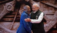 India's Prime Minister Narendra Modi (R) gestures with African Union Chairman and Comoros President Azali Assoumani ahead of the G20 Leaders' Summit at the Bharat Mandapam in New Delhi on September 9, 2023. (Photo by Evan Vucci / POOL / AFP)