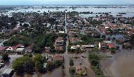 This aerial view taken on September 8, 2023, shows the flooded village of Palamas, near the city of Karditsa, central Greece. (Photo by Angelos Tzortzinis / AFP)