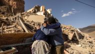 Family members react near the rubble of collapsed buildings in the village of Imi N'Tala near Amizmiz in central Morocco, on September 10, 2023. (Photo by Fadel Senna / AFP)