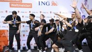 Members of the German Basketball world champions cheer with their trophy to celebrate their victory on September 12, 2023, in the center of Frankfurt, western Germany after they returned from the FIBA Basketball World Cup held in the Philippines. Photo by Kirill KUDRYAVTSEV / AFP