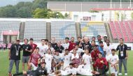 Qatar U-23 players and officials pose for a photo after defeating Kyrgyz Republic yesterday.